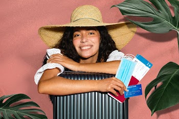 Female traveler with a face mask tan line after new normal vacation