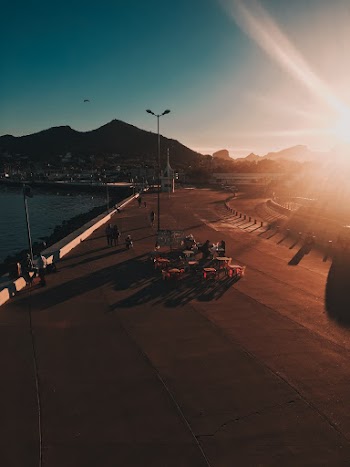Few People on Road Near Sea
