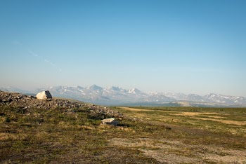 Field With View Of Mountains