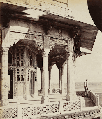 figure on a balcony of an | Free Photo - rawpixel
