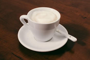 Filled Ceramic Mug on Saucer