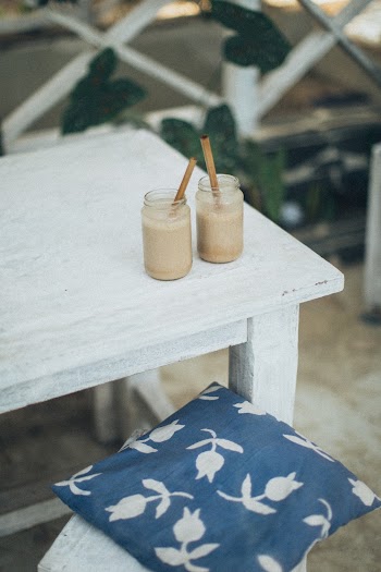 Filled Glass Cups With Straws On Table