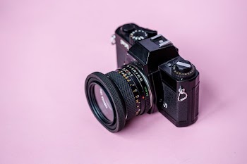 Film Camera On Pink Background