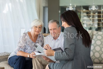 Financial advisor meeting with senior couple