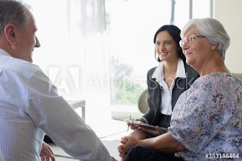 Financial advisor meeting with senior couple
