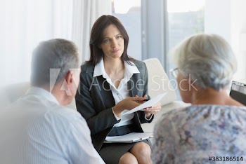 Financial advisor meeting with senior couple