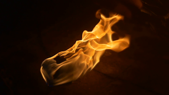 Fire Torch is Burning Slow Motion Male Hand Appears Puts a Few ...