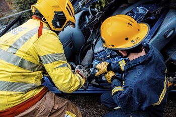 Firefighter fixing car. Original public | Free Photo - rawpixel