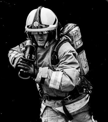 Firefighter holding water hose, June | Free Photo - rawpixel