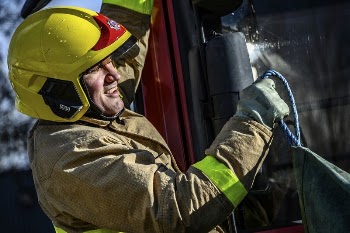 Firefighter pulling rope, March 6, | Free Photo - rawpixel