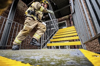 Firefighter running on stairs, June | Free Photo - rawpixel