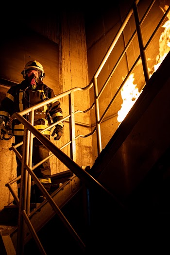 Firefighter Standing on Stairs
