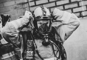 Firefighter wearing protective mask, December | Free Photo - rawpixel