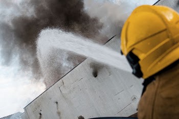 Fireman with fire hose. Original | Free Photo - rawpixel