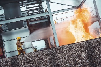 Fireman with fire hose. Original | Free Photo - rawpixel