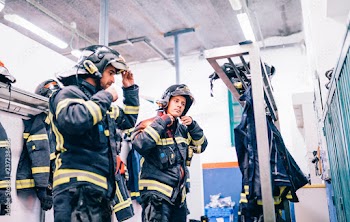 Firemen preparing for emergency service.
