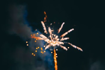 fireworks under cloudy sky