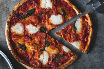 First Slice Of Fresh Margarita Pizza