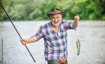 Fish farming pisciculture raising fish commercially. Pensioner leisure. Fisherman alone stand in river water. Hobby sport activity. Fish on hook. Man senior fisherman. Fisherman fishing equipment