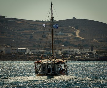 Fishing Boat in the Middle of Body of Water