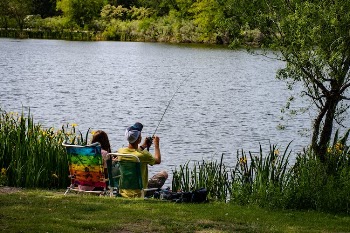 Fishing Man Wearing Yellow Shirt