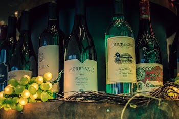 Five Assorted-variety Labeled Bottles