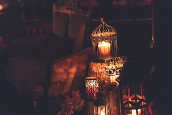 Five Lighted Candles on Cages
