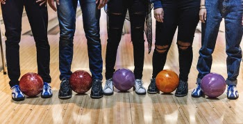 Five Man Standing Bowling Balls
