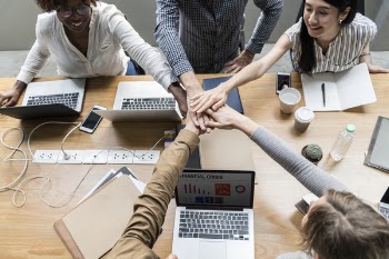 Five People Huddling