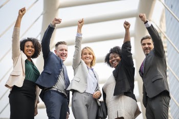 Five People Raising Hands
