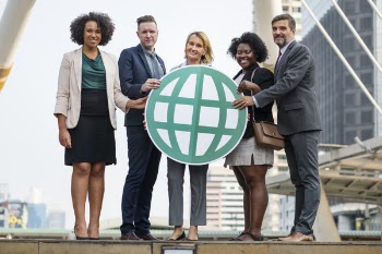Five People Standing While Holding Green Globe Art