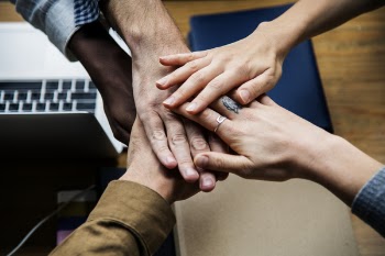 Five Person Holding Hands Together