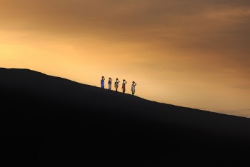 Five Persons Standing on Mountain