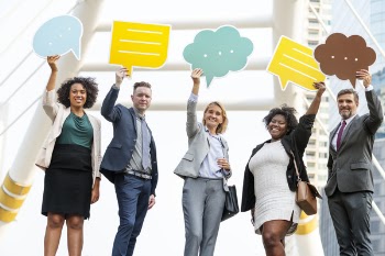 Five Standing People Holding Message Clouds