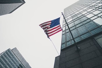 flag of America waving under gray skies