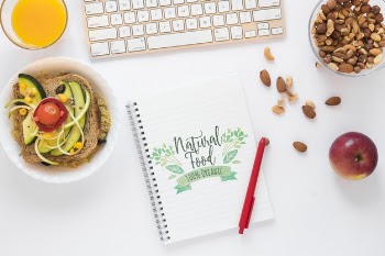 Flat lay of healthy food with notepad mockup Free Psd