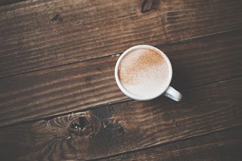 flat lay photography of a single cup coffee