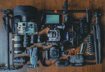 flat lay photography of cameras and camera gear