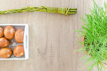 Flat Lay Photography of Eggs and Green Plant on Top of Table