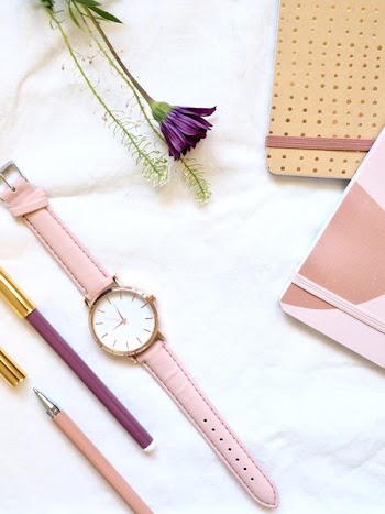Flat lay Photography of Watch Near Pens and Notebook