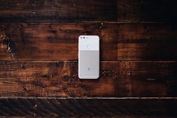flat lay photography of white Google Pixel Android smartphone