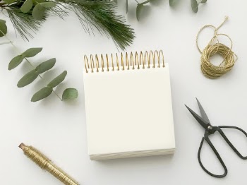 Flatlay arrangement with writing pad