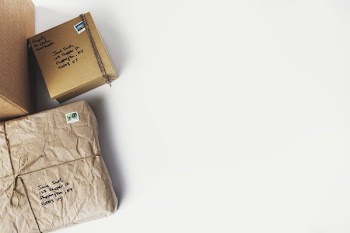 Flatlay Of Boxes On Left Side Of Table