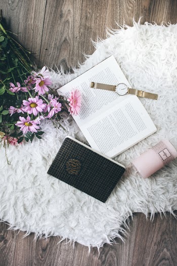 Flatlay Photo of a Watch on Book