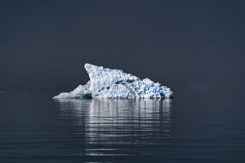 Floating piece of cold water dissolving in salt