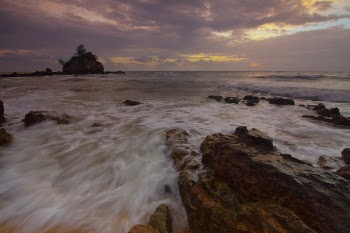 Flowing Water to the Ocean Under Grey Sky