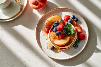 Fluffy American Pancakes with Fresh Berries and Peaches