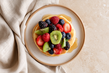 Fluffy Pancakes with Fresh Berries and Kiwi