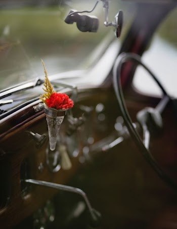 focus photo of flower inside vehicle