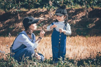 Focus Photo of Woman and Girl